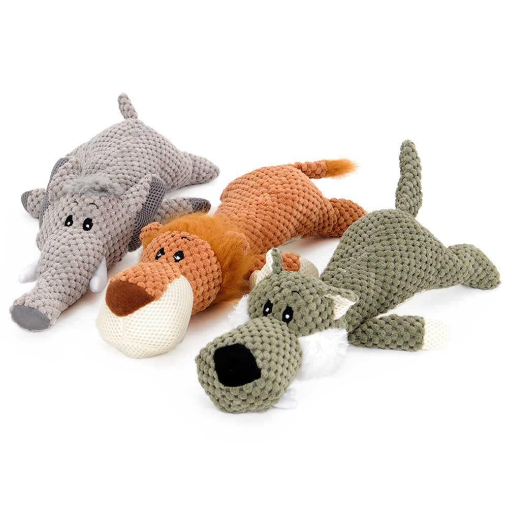Gray elephant, orange lion and green wolf squeaky plush animal dog toys laid flat on a white background.