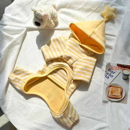 Flat lay of the striped dog pajamas showing the yellow lined star hood and four-leg design.
