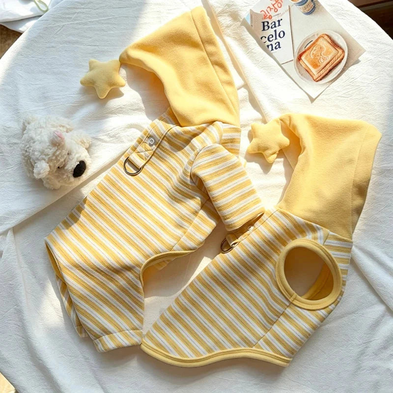 Striped dog pajamas laid open to show the snap front and leg openings.