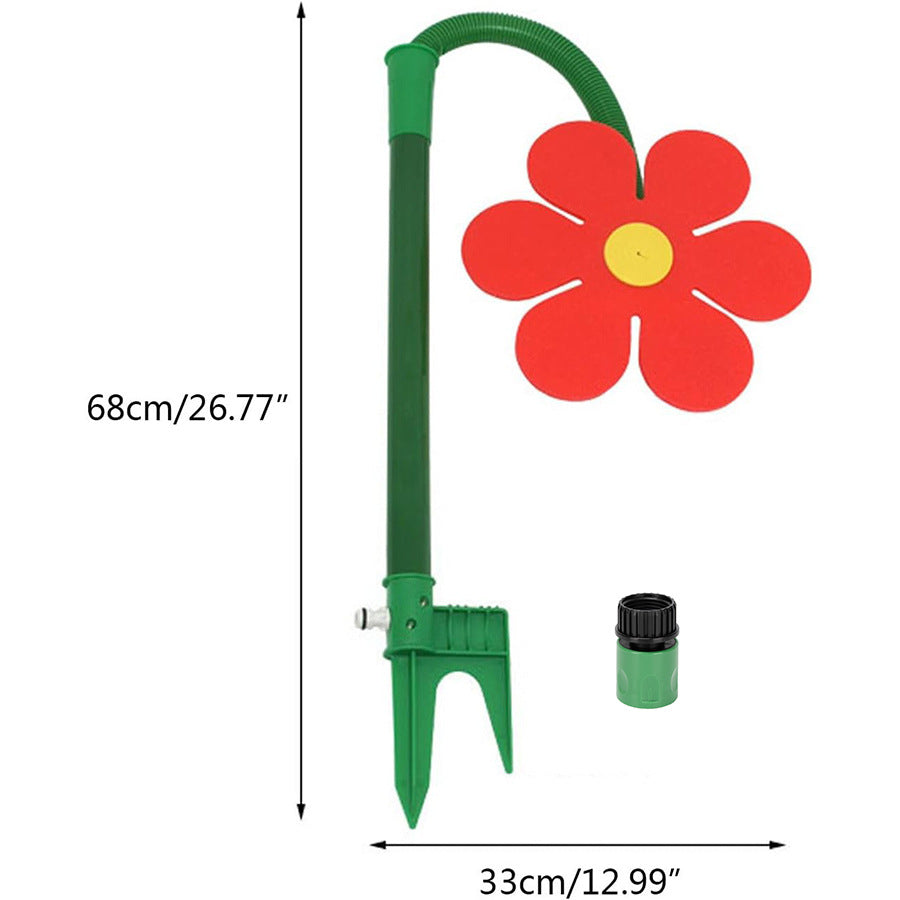 Red sunflower sprinkler for dogs with its 68 cm height and 33 cm width marked and the hose connector beside it.