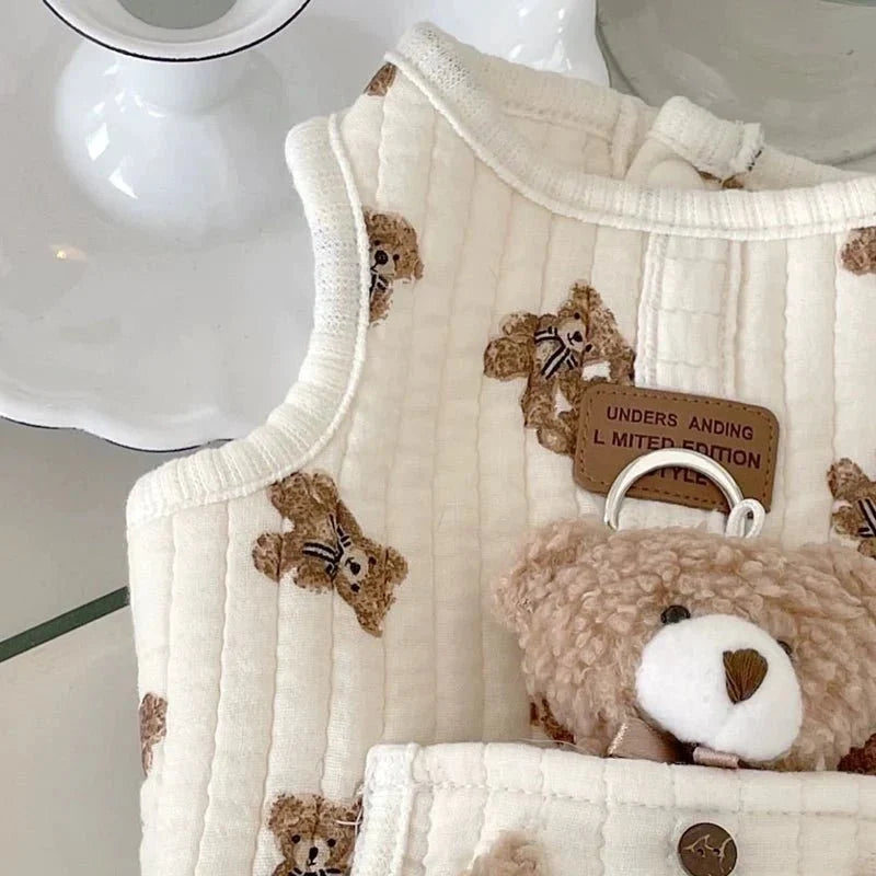 Close-up of the quilted fabric, embroidered bears and label on the dog harness vest