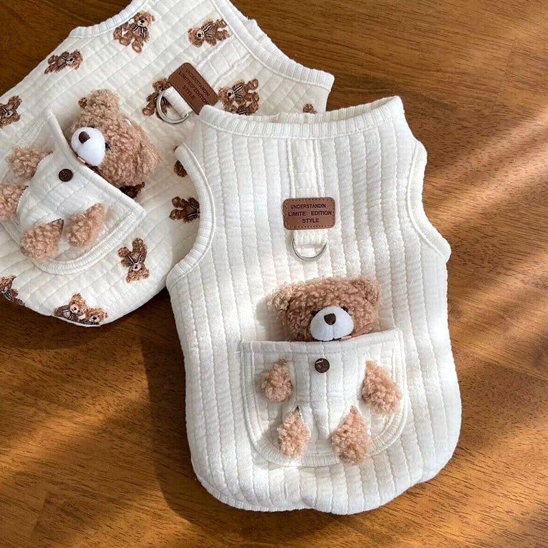 Bear print and solid white dog harness vests side by side showing the back leash ring