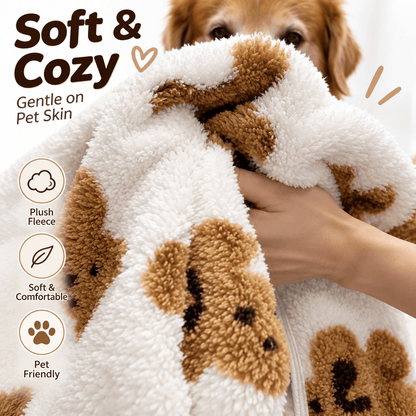 Hand holding the white teddy bear fleece dog vest to show its thick plush fabric up close.