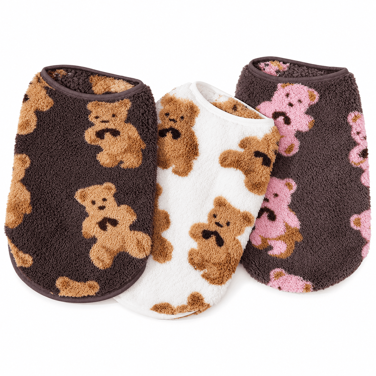 Three teddy bear fleece dog vests in brown with tan bears, white and brown with pink bears.