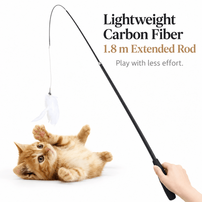 A hand holding the lightweight carbon fiber telescopic feather cat wand while a ginger kitten rolls on its back below the feathers.