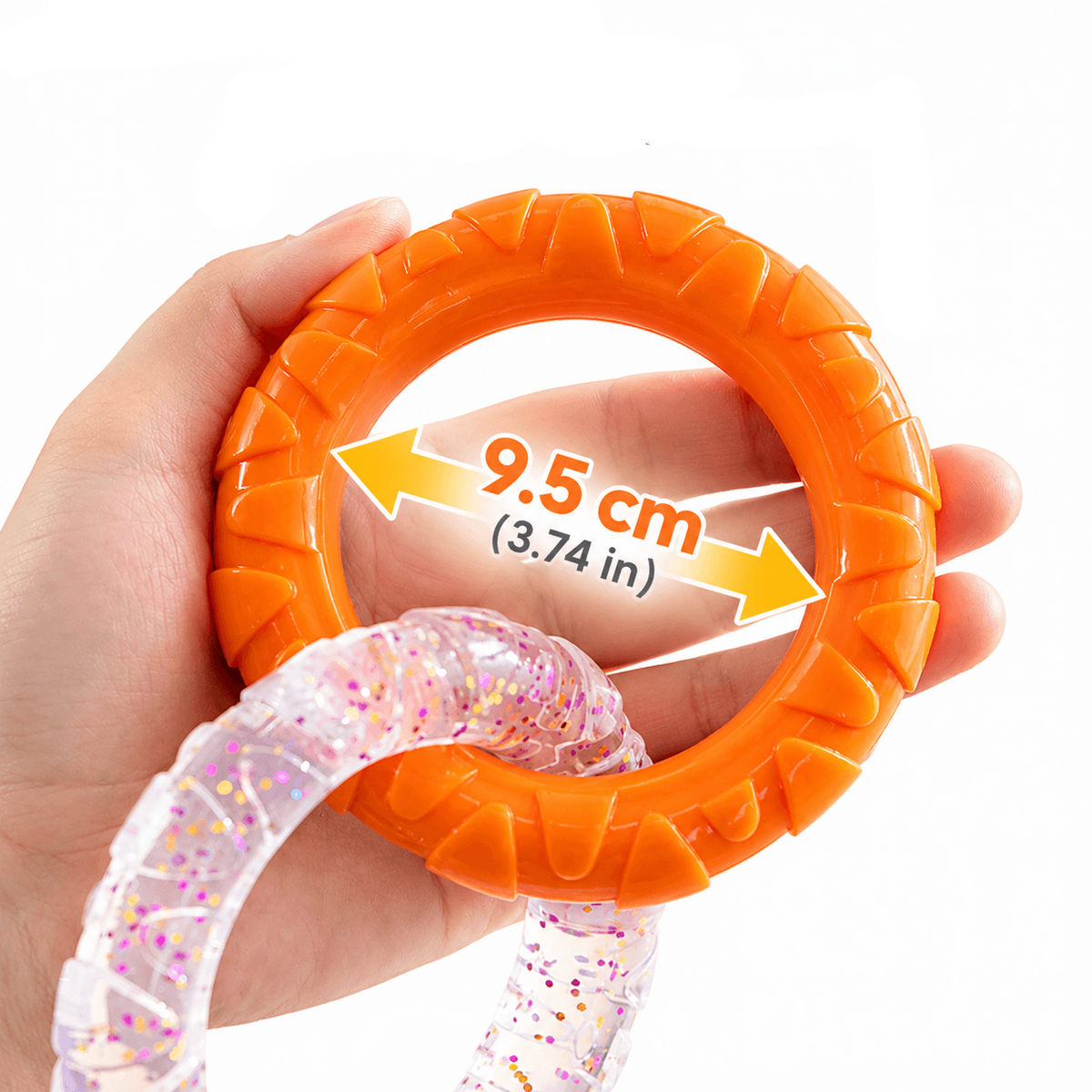 A hand holds one orange ring with an arrow marking the 9.5 cm diameter across the opening.