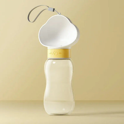 White 600 ml travel dog water bottle with cloud-shaped cup and lanyard.
