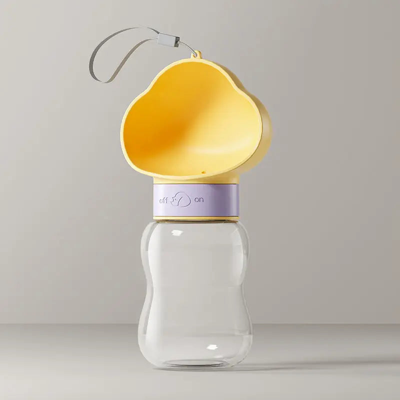 Yellow 350 ml travel dog water bottle with cloud-shaped cup and lanyard.