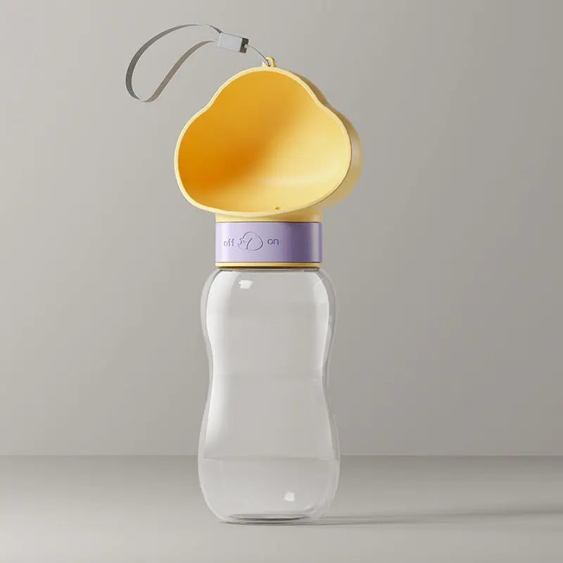 Yellow 600 ml travel dog water bottle with cloud-shaped cup and lanyard.