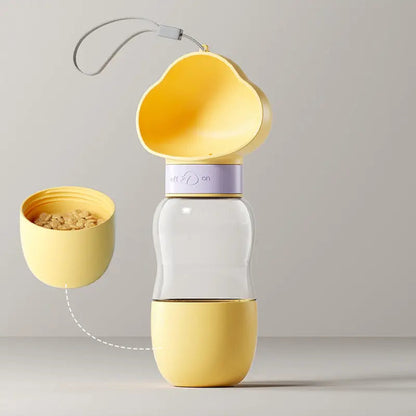 Yellow travel dog water bottle with the 200 ml food jar detached from its base, 350 ml bottle.