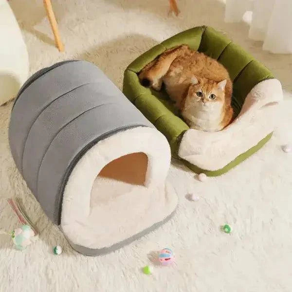 The enclosed cave bed shown in green and in gray side by side with a cat in one of them.