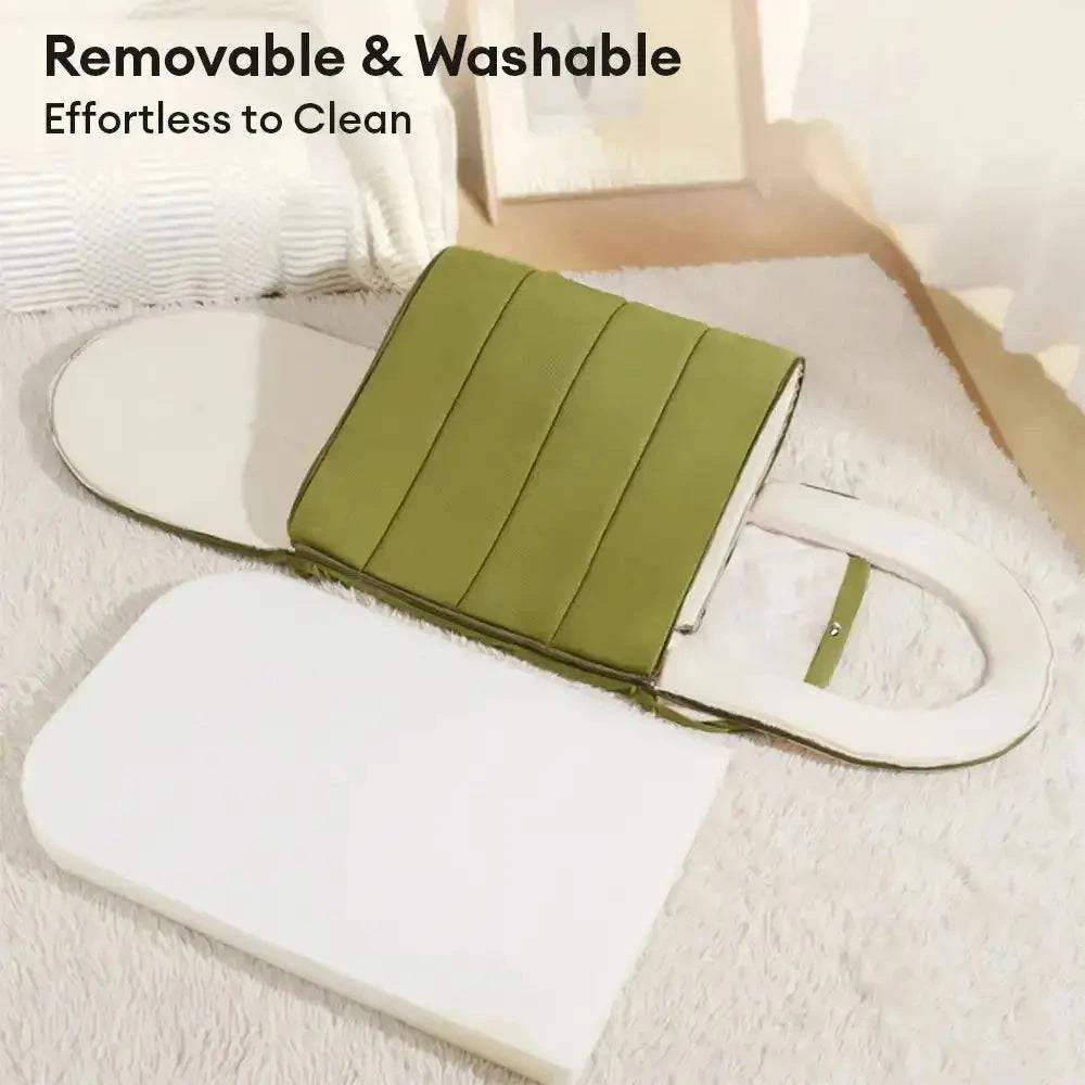 The cave bed with its cover peeled back from the base cushion, captioned removable and washable.