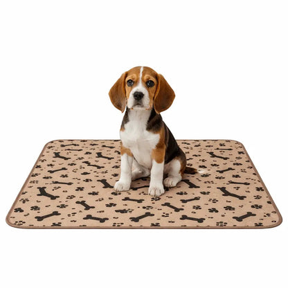 Beagle puppy sitting on the beige bone and paw print washable pee pad.