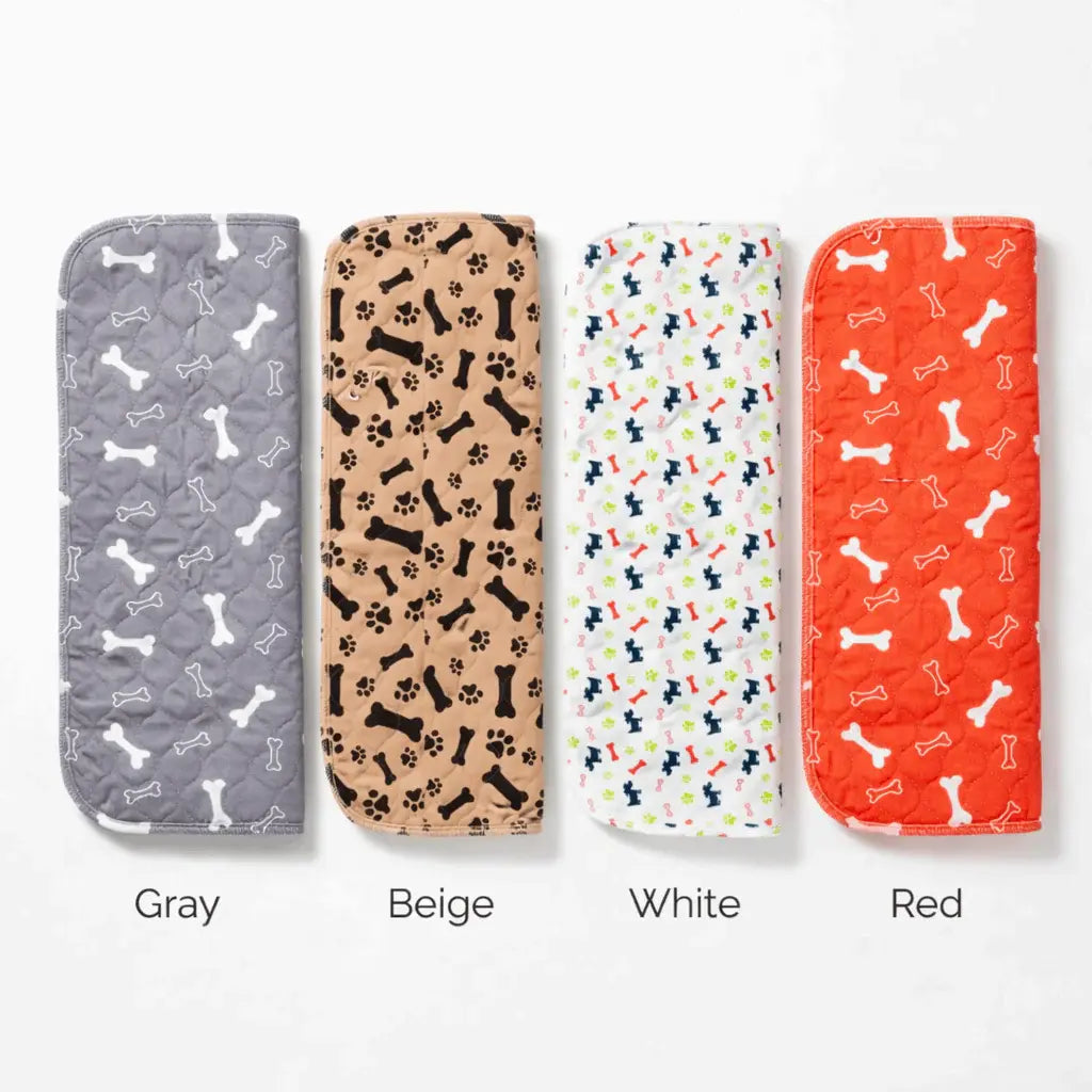 Washable pee pads for dogs rolled in gray, beige, white and red patterns.