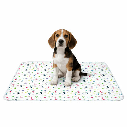 Beagle puppy sitting on the white patterned washable pee pad.