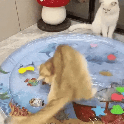 A hand pressing the clear surface of the play mat while the loose fish slide underneath.