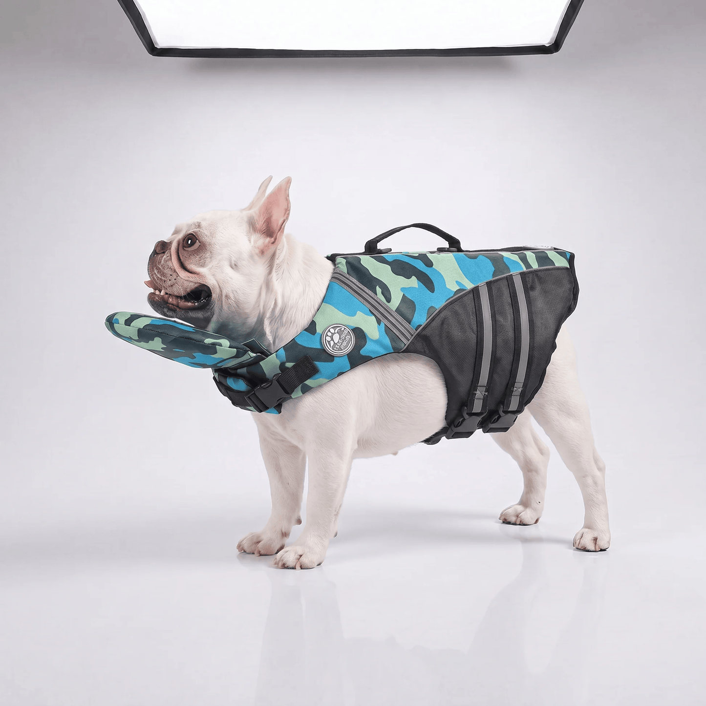 Blue camo Noblias dog life jacket with head support, adjustable straps, and secure fit for swimming and safety.
