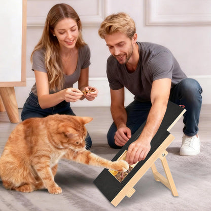 Orange cat using a pet scratch board with built in treat box while owners reward training